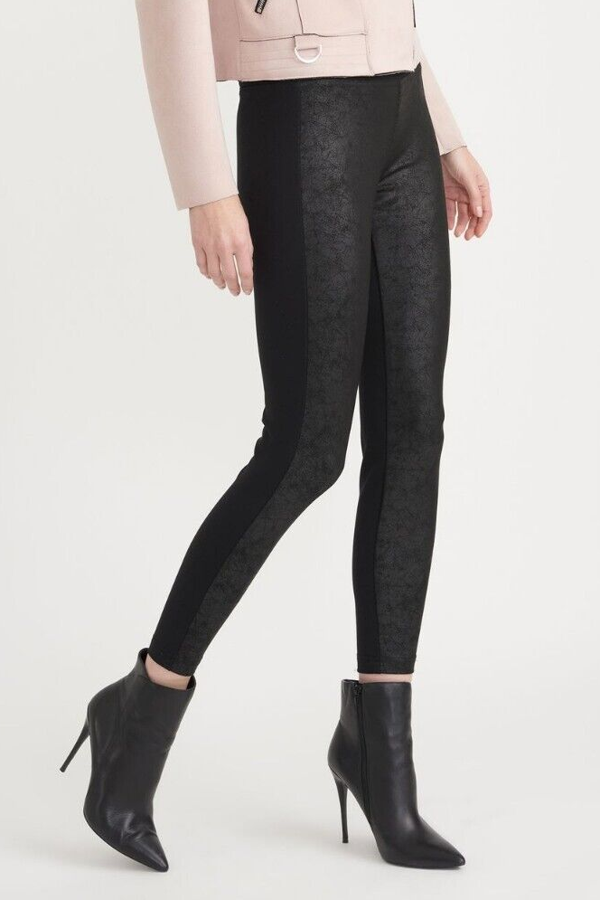 Woman wearing Joseph Ribkoff black textured print skinny pull-on pants, size 6, styled with heeled ankle boots.